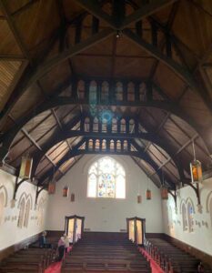 Timber vaulted ceiling and pews