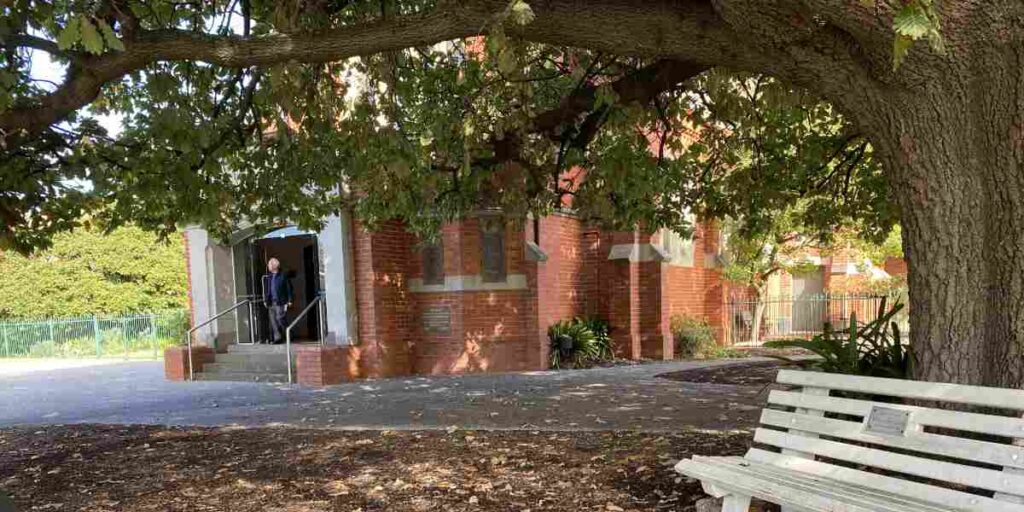 white seat under oak tree at Stonnington Community UC